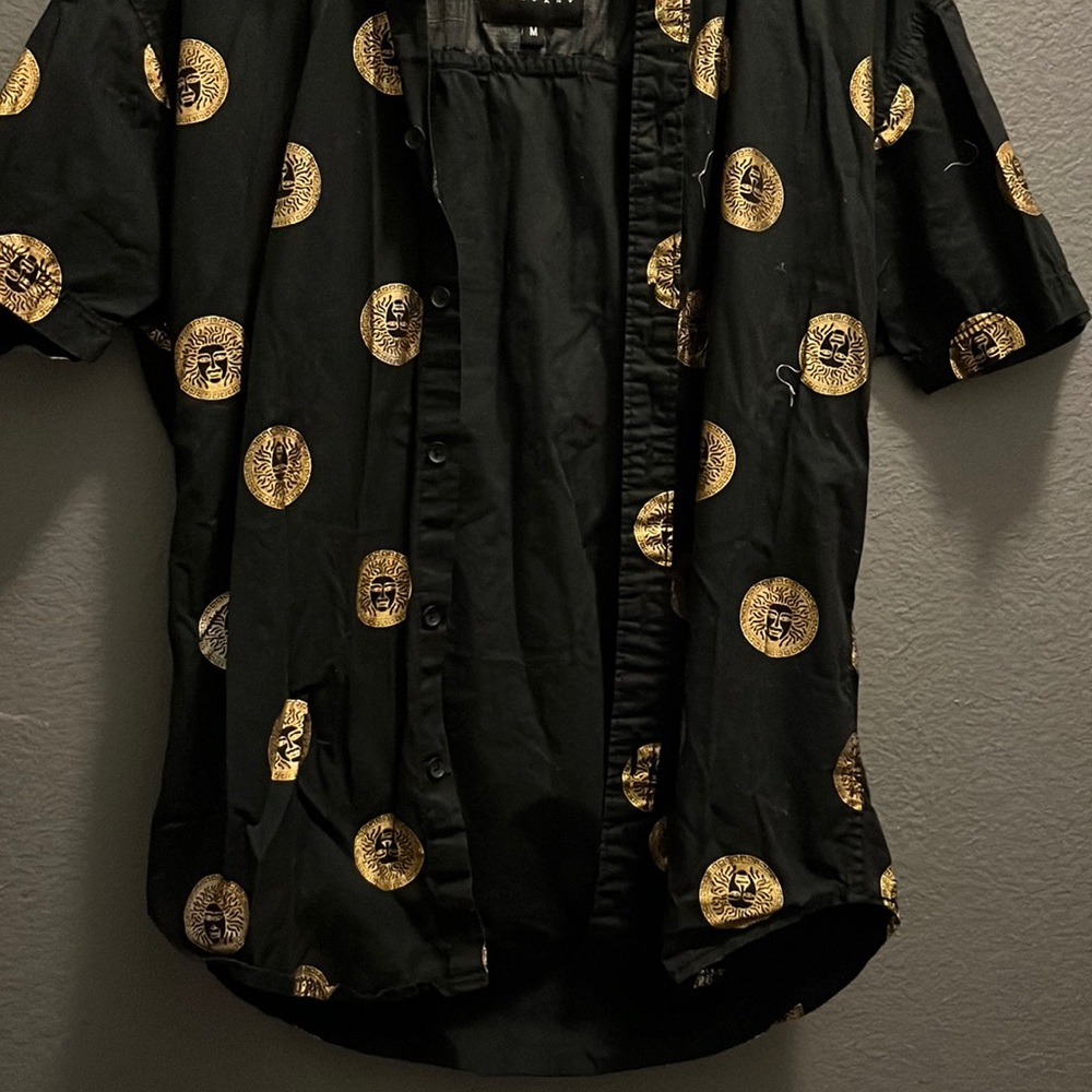 Gold and black man’s shirt